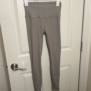 Tan + Lines sage green ribbed leggings.